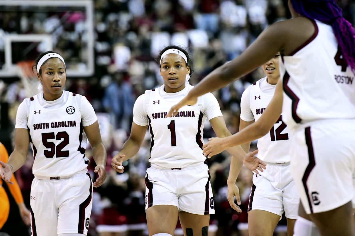 South Carolina guard Zia Cooke (1) and Tyasha Harris (52) walk to the huddle after a score during the first half of an NCAA college basketball game against Tennessee, Sunday, Feb. 2, 2020, in Columbia, S.C. (AP Photo/Sean Rayford)