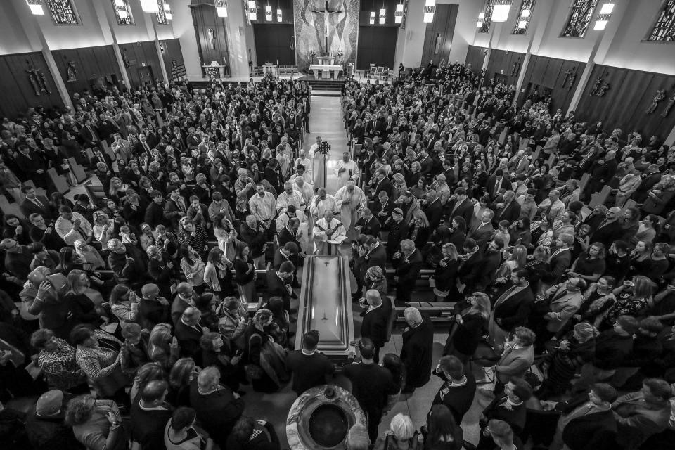 It was standing room only for the funeral services of Carrie and Kacey McCaw at St. Raphael the Archangel Catholic Church.  The mother and daughter were laid to rest in a single casket after they were killed in a head-on collision on their way to a volleyball tournament in Kansas City on Valentine's Day.