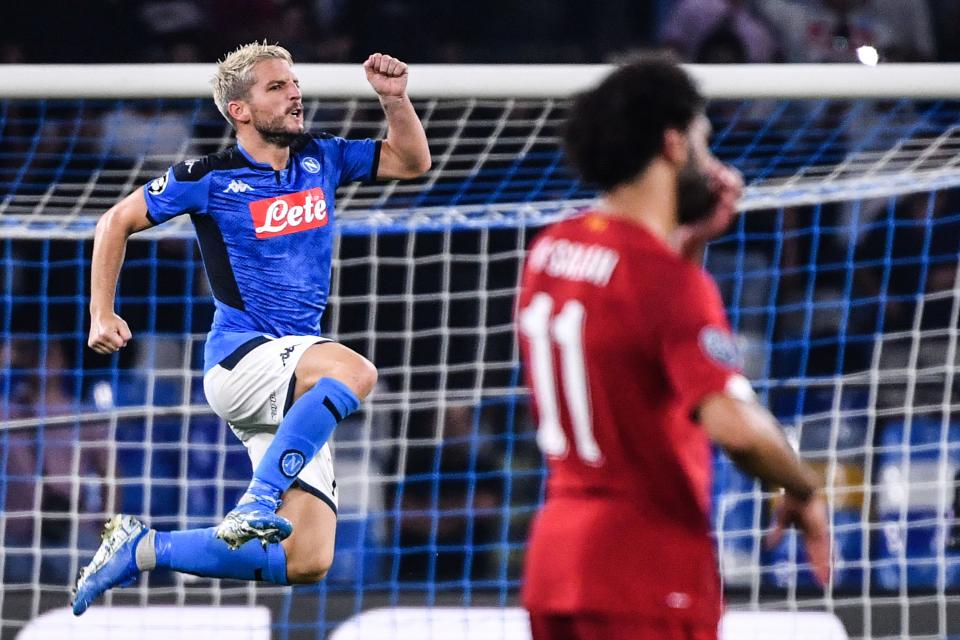 Napoli's Belgian forward Dries Mertens celebrates next to Liverpool's Egyptian midfielder Mohamed Salah after scoring a penalty during the UEFA Champions League Group E football match Napoli vs Liverpool on September 17, 2019 at the San Paolo stadium in Naples. (Photo by Alberto PIZZOLI / AFP)        (Photo credit should read ALBERTO PIZZOLI/AFP/Getty Images)