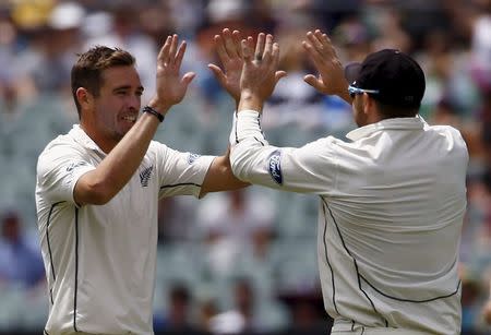 New Zealand's captain Brendon McCullum (R) celebrates with team mate Tim Southee after he ran out Australia's Shaun Marsh for two runs during the second day of the third cricket test match at the Adelaide Oval, in South Australia, November 28, 2015. REUTERS/David Gray