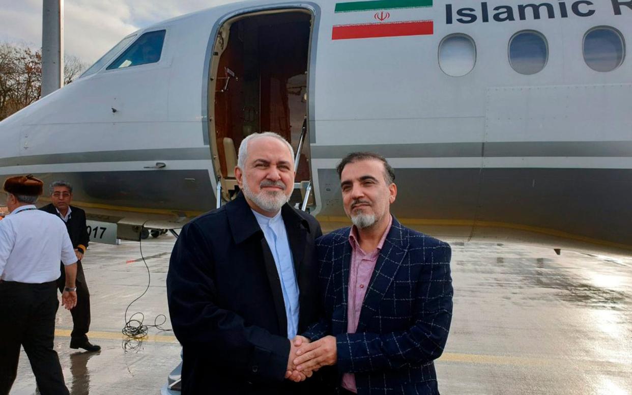 Iran's Foreign Minister Mohammad Javad Zarif , Zarif, left, shakes hand with Iranian scientist Massoud Soleimani prior to leaving Zurich, Switzerland for Tehran, Iran, Saturday, Dec. 7, 2019 - Javad Zarif twitter account