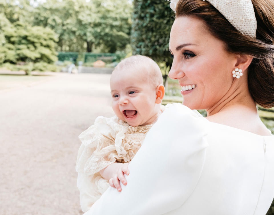 Catherine, Duchess of Cambridge and Prince Louis on the grounds of Clarence House in St James' Palace following his christening on July 9, 2018.