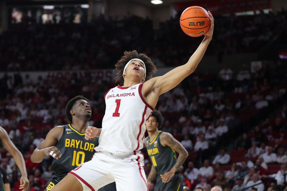 OU forward Jalen Hill (1) gathers the ball in front of Baylor guard Adam Flagler (10) during the Bears' 62-60 win on Jan. 21 in Norman.