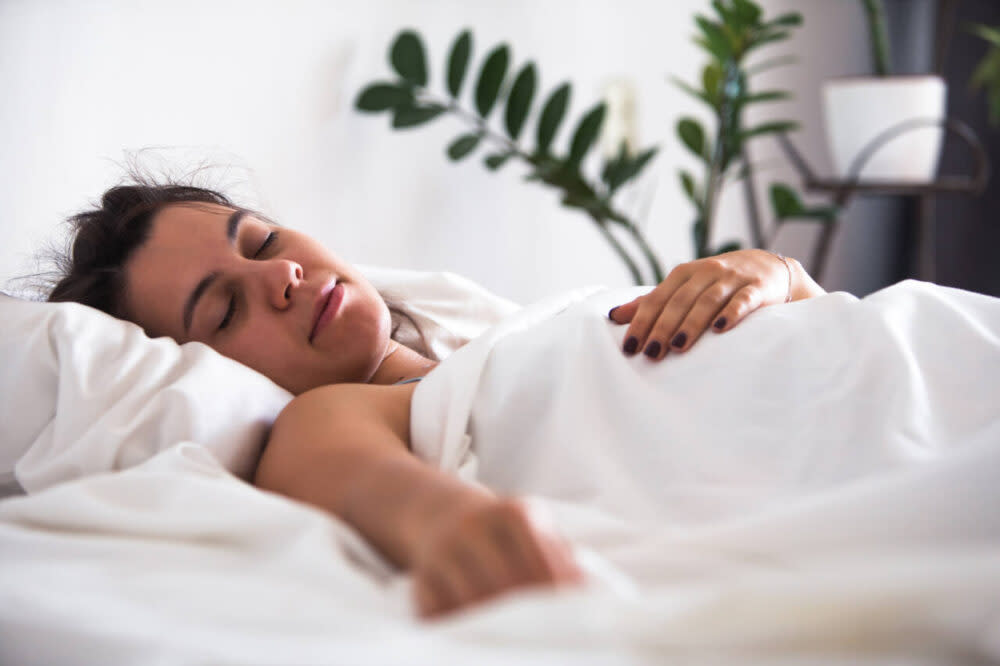 woman asleep near plants