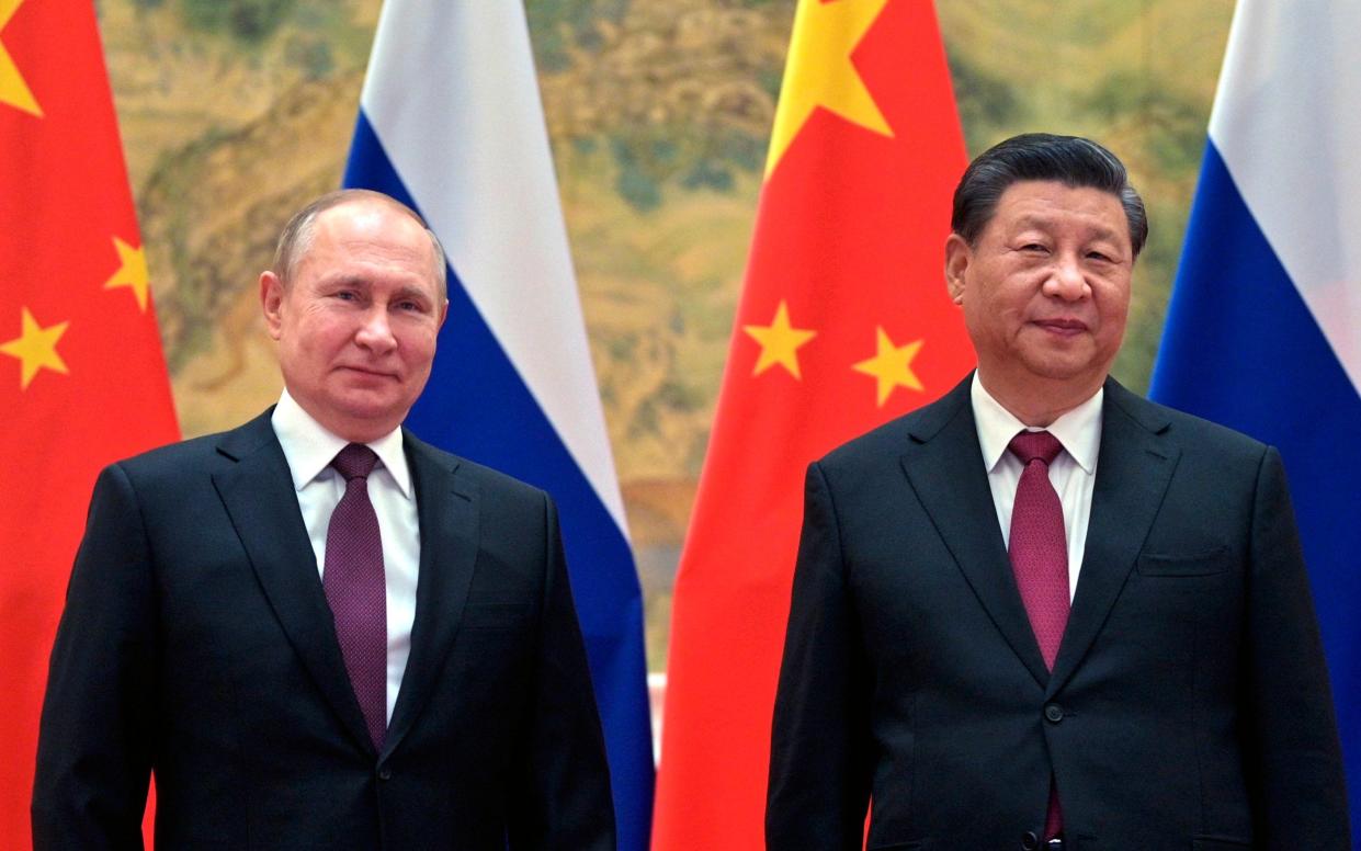 Chinese President Xi Jinping and Russian President Vladimir Putin pose for a photo in Beijing, China