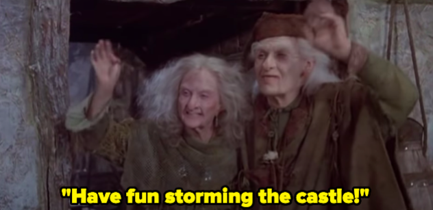 A woman and a man waving, shouting "Have fun storming the castle!"