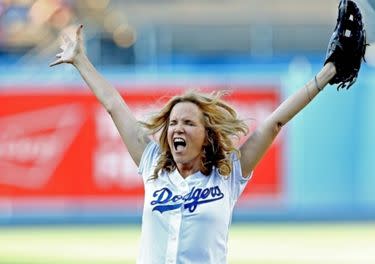 Rob Lowe and Jason Bateman sport fan merchandise at the LA Dodgers