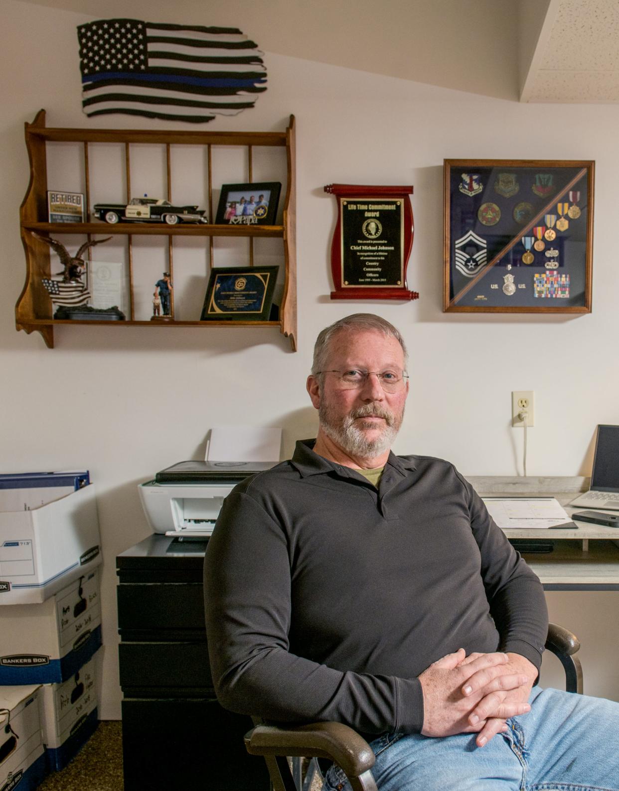 Retired Fon du Lac Park Police Chief Mike Johnson sits in the basement office of his East Peoria home. In his 29 years with the department, the Air Force veteran built the department's river policing program from the ground up into the primary resource for local law enforcement on the Illinois River.