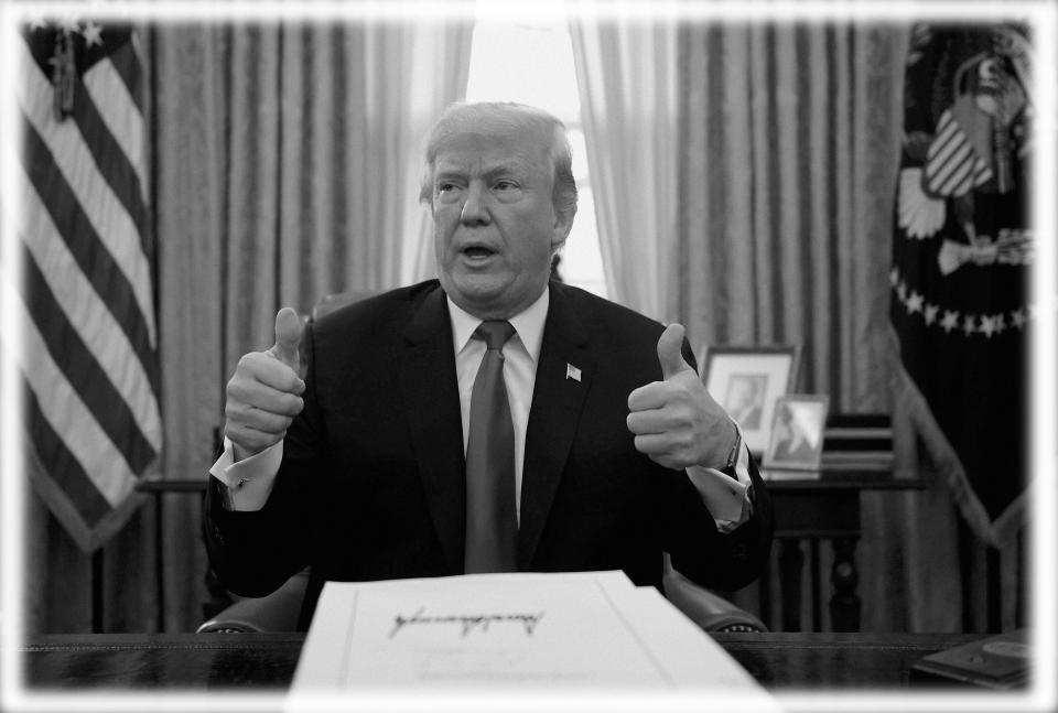 President Trump at the signing of the Tax Cuts and Jobs Act in 2017. (Photo: Brendan Smialowsky/AFP/Getty Images)