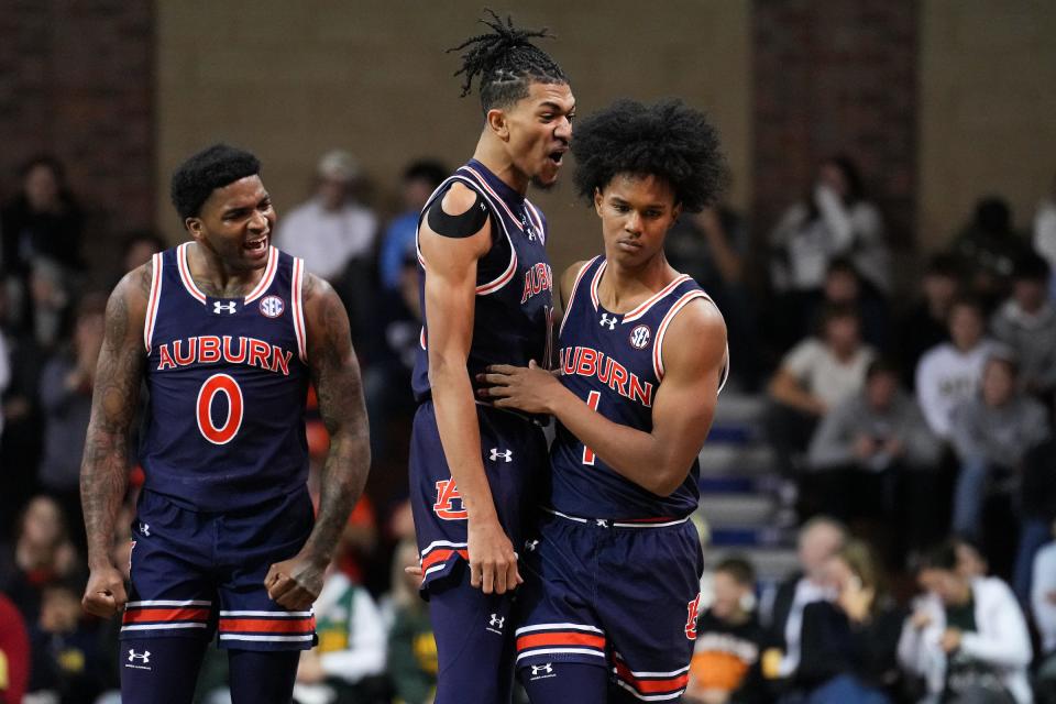 Auburn basketball's Aden Holloway (1), Chad Baker-Mazara (10) and K.D. Johnson (0) during a game between the Tigers and Baylor at Sanford Pentagon in Sioux Falls, South Dakota on Nov. 7, 2023.