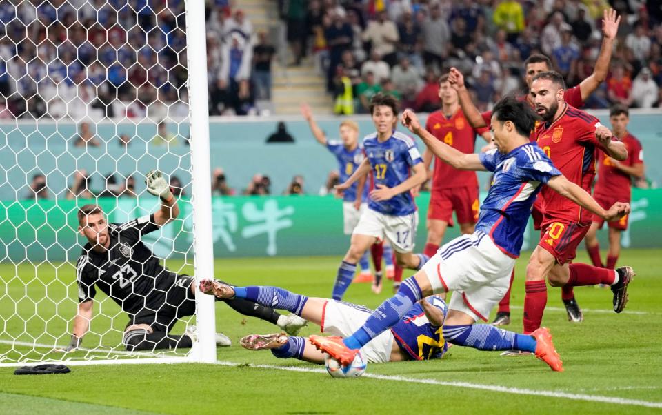 Kaoru Mitoma crosses the ball for Japan's winner against Spain - Eugene Hoshiko /AP