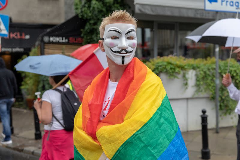 People participate in an anti-government demonstration in Warsaw