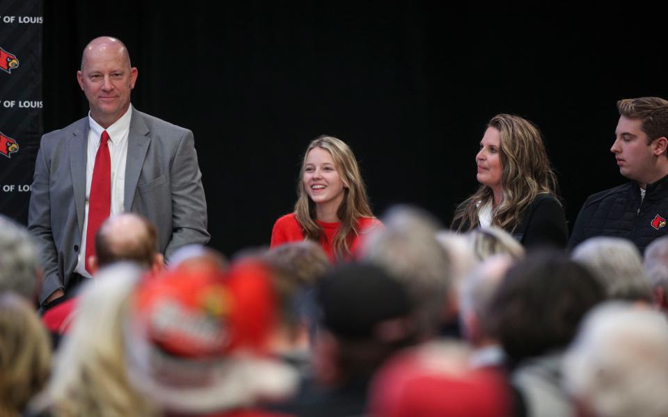 Jeff Brohm, with daughter Brooke, wife Jennifer and son Brady Thursday afternoon at Brohm's introduction as head football coach for the University of Louisville.   Dec. 8, 2022