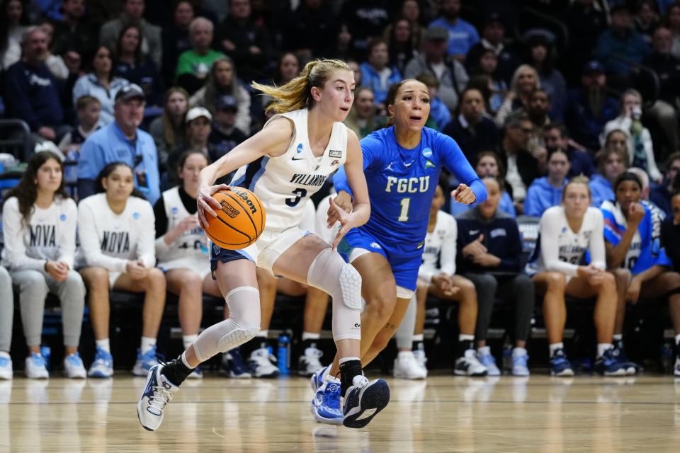 Villanova's Lucy Olsen (3) drives past Florida Gulf Coast's Alyza Winston during the second half of a second-round college basketball game in the NCAA Tournament, Monday, March 20, 2023, in Villanova, Pa. (AP Photo/Matt Rourke)