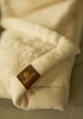 <p><span>Wave goodbye to the cheap, static blankets of economy class that literally leave your hair standing on end. Instead, snuggle down beneath a faux sheepskin blanket. Emirates offers these plush comforters to First Class passengers – and they are so popular that they now also sell them online for £48 a pop. [Photo: Emirates]</span> </p>