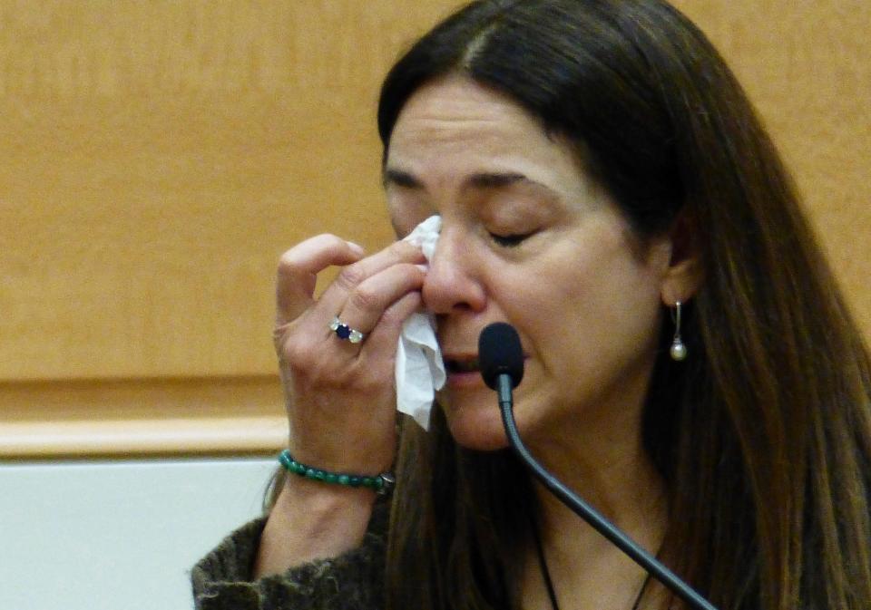 Sandy Hook mother Francine Wheeler pauses to wipe away tears as she testifies against Alex Jones on 4 October (AP)