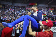 Gold medalist Joe Fraser of Great Britain celebrates after his performance on the parallel bars in the men's apparatus finals at the Gymnastics World Championships in Stuttgart, Germany, Sunday, Oct. 13, 2019. (AP Photo/Matthias Schrader)