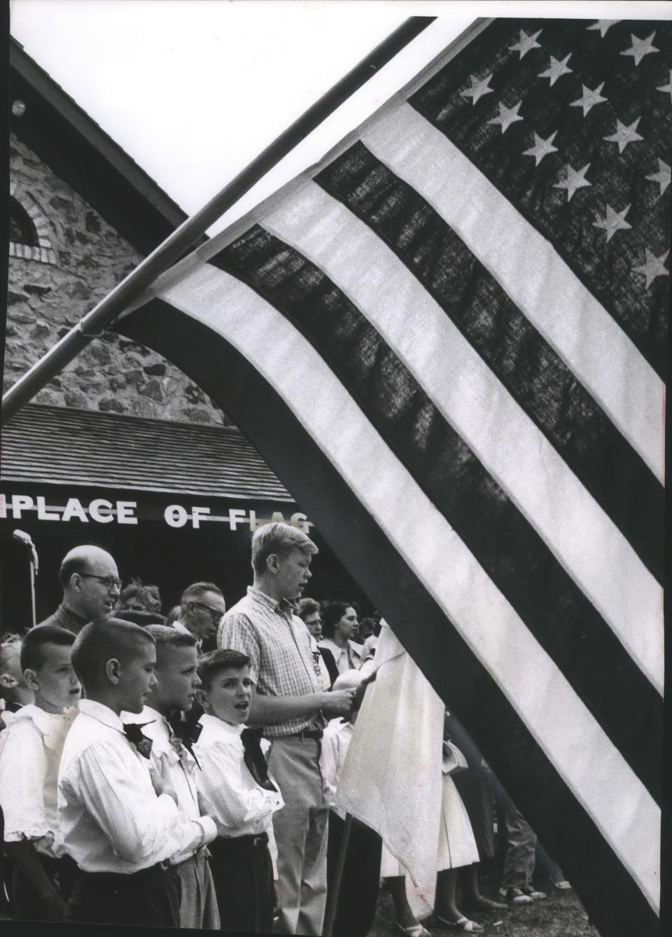 Students say the pledge of allegiance in this 1968 Flag Day photo.