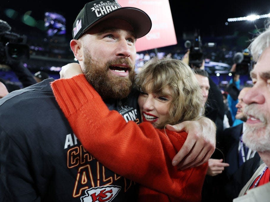 Travis Kelce #87 of the Kansas City Chiefs celebrates with Taylor Swift after a 17-10 victory against the Baltimore Ravens in the AFC Championship Game at M&T Bank Stadium on January 28, 2024 in Baltimore, Maryland.