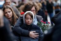 People mourn outside the synagogue in Halle