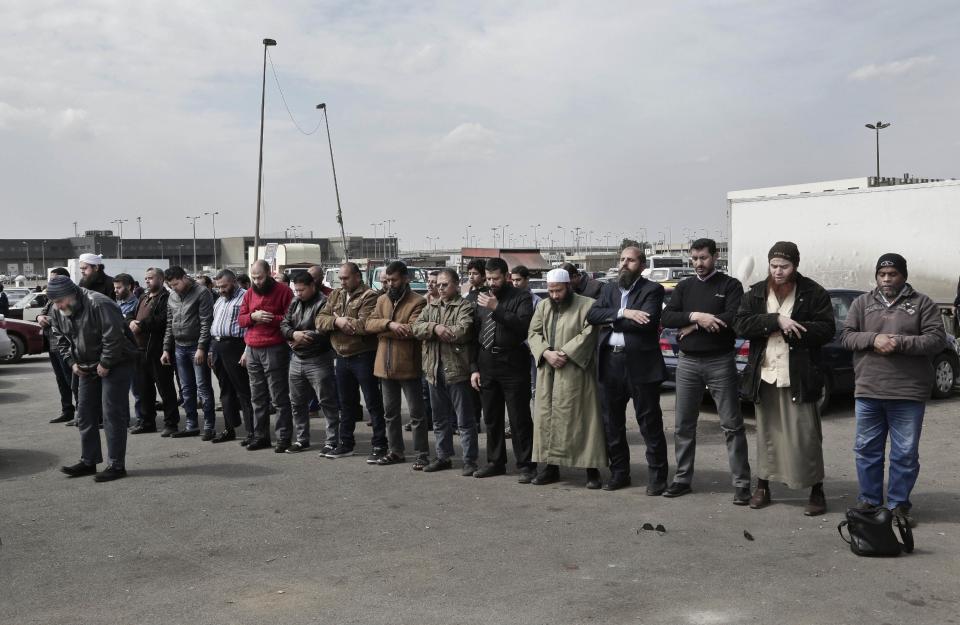 Family and relatives of Sheik Omar Abdel-Rahman, who was convicted of plotting terror attacks in New York City in the decade before 9/11, pray as they wait for the bodies arrival at Cairo International Airport, in Egypt, Wednesday, Feb. 22, 2017. Abdel-Rahman, blind since infancy from diabetes, had diabetes and coronary artery disease, died Saturday at the Federal Correction Complex in Butner, North Carolina, said its acting executive assistant, Kenneth McKoy. The inmate spent seven years at the prison medical facility while serving a life sentence. (AP Photo/Nariman El-Mofty)