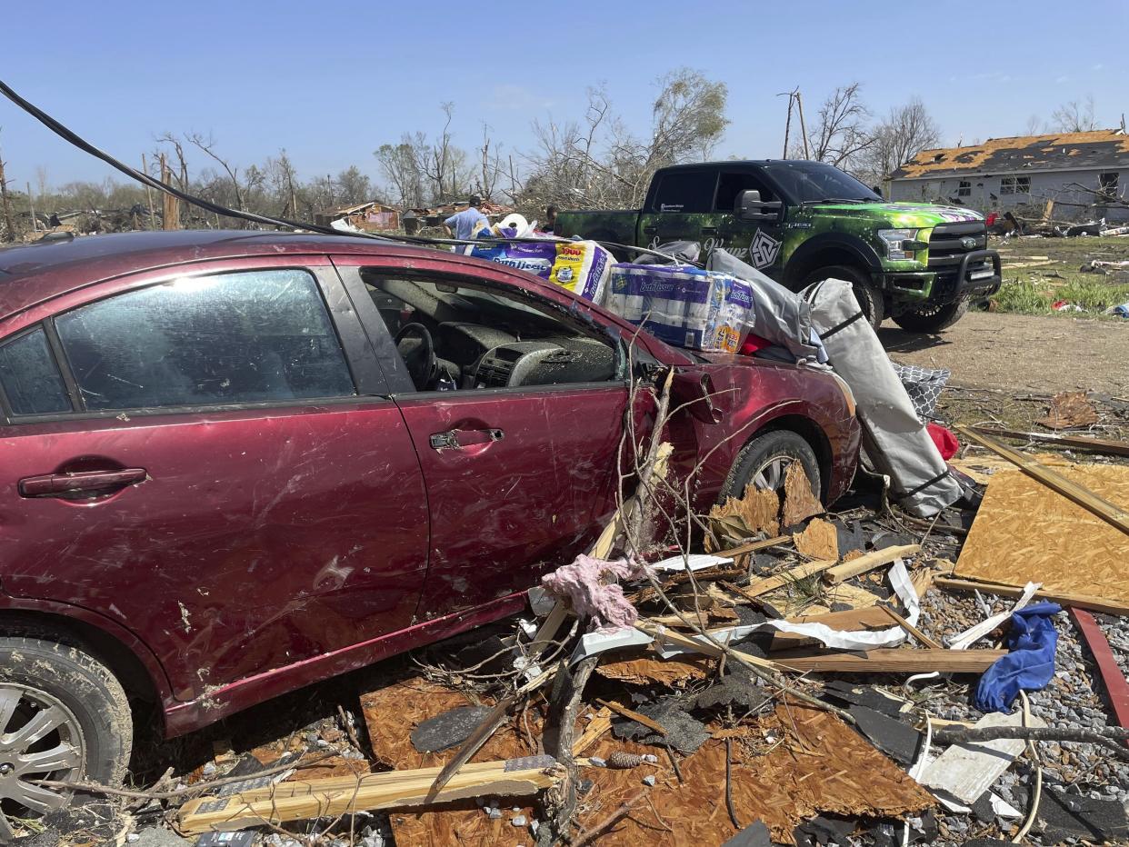 Debris covers the ground on Saturday, March 25, 2023 in Silver City, Miss. Emergency officials in Mississippi say several people have been killed by tornadoes that tore through the state on Friday night, destroying buildings and knocking out power as severe weather produced hail the size of golf balls moved through several southern states. (AP Photo/Michael Goldberg)