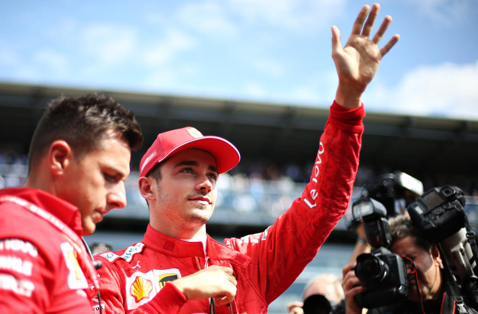 MONZA, ITALY - SEPTEMBER 08: Charles Leclerc of Monaco and Ferrari waves to the crowd from the grid before the F1 Grand Prix of Italy at Autodromo di Monza on September 08, 2019 in Monza, Italy. (Photo by Charles Coates/Getty Images)