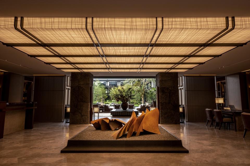 Acclaimed Hong Kong–based designer André Fu worked with contemporary artists like Yukiya Izumita, who created the massive ceramic sculpture that sits on a bed of raked sand in the lobby.