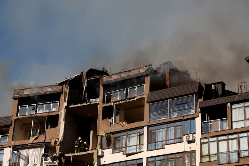 Smoke rises over a residential building damaged by a Russian missile strike, in Kyiv