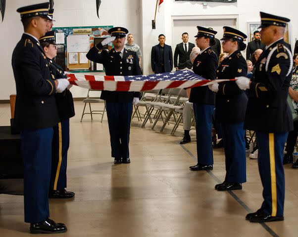 <p>U.S. Army National Guard photo by Spc. Adrianne Lopez</p> The Nevada National Guard fold a U.S. flag during the ceremony to honor Garrison Brown