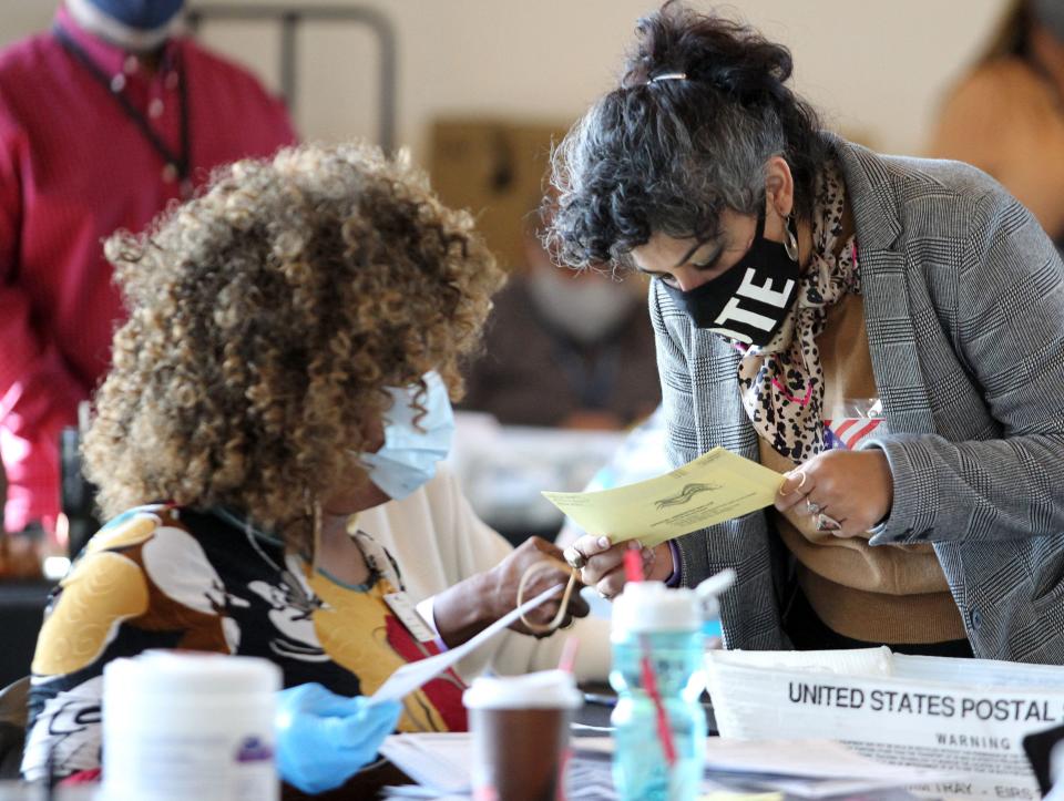 (FILES) Fulton County election workers examine ballots while vote counting, at State Farm Arena on November 5, 2020, in Atlanta, Georgia. Donald Trump was indicted August 14, 2023 on charges of racketeering and a string of election crimes after a sprawling two-year probe into his efforts to overturn his 2020 defeat to Joe Biden in the US state of Georgia, according to a court filing.

The case -- relying on laws typically used to bring down mobsters -- is the fourth targeting the 77-year-old Republican this year and could lead to a watershed moment, the first televised trial of a former president in US history. (Photo by Tami Chappell / AFP) (Photo by TAMI CHAPPELL/AFP via Getty Images) ORIG FILE ID: AFP_33R678U.jpg