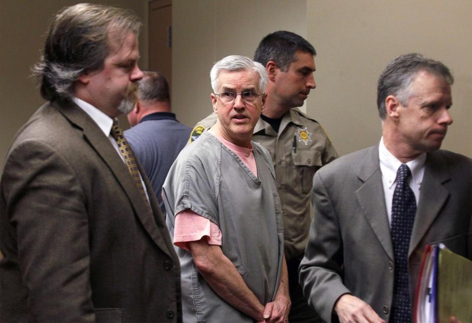 PHOTO: Charles and Judy Cox, the parents of Susan Powell, enter a courtroom in Salt Lake City, July 8, 2014. (Ted S. Warren/AP, FILE)