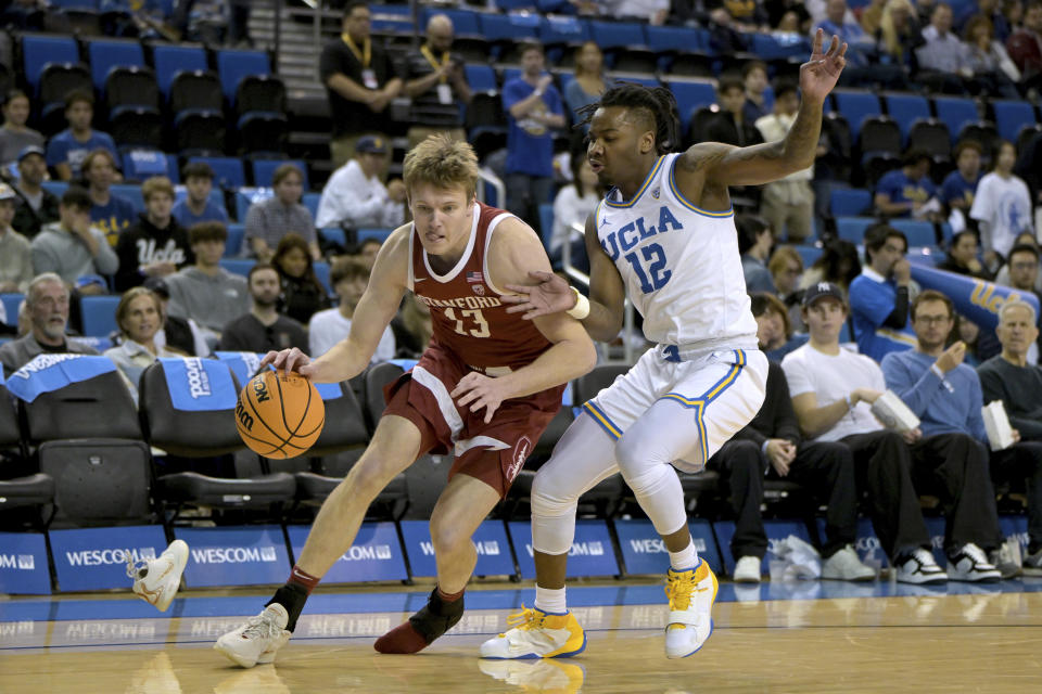 Stanford guard Michael Jones, left, loses a shoe as he drives past UCLA guard Sebastian Mack during the first half of an NCAA college basketball game Wednesday, Jan. 3, 2024, in Los Angeles. (AP Photo/Jayne Kamin-Oncea)