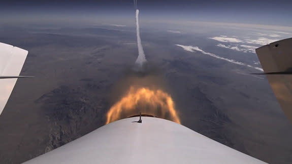 A camera mounted on Virgin Galactic's SpaceShipTwo shows shows the view behind the spacecraft as it took its second powered test flight over the Mojave Air and Space Port on Sept. 5, 2013.