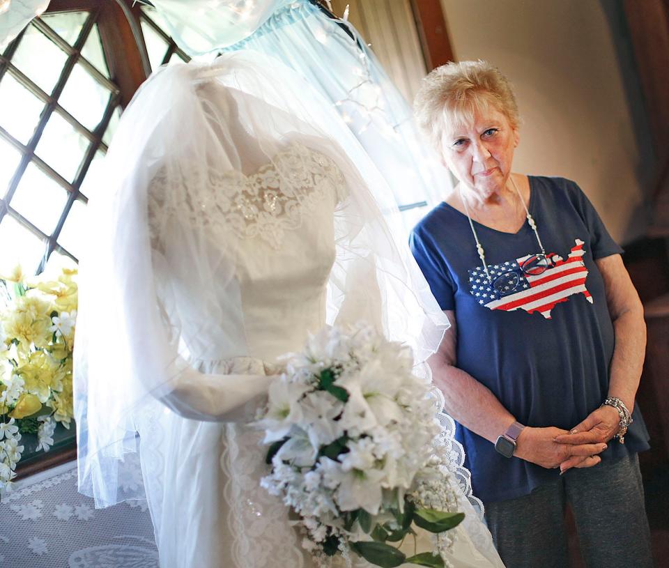 Tina Gagne, of Marshfield, with her wedding dress from 1969. She has been married to David Gagne for 53 years, Monday, May 16, 2022.