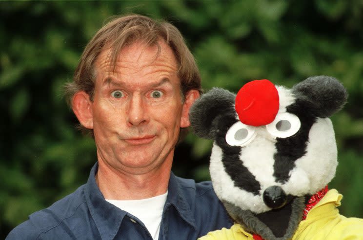 Children’s presenter Andy Cunningham and his co-star from the BBC programme ‘Bodger and Badger’. (PA)