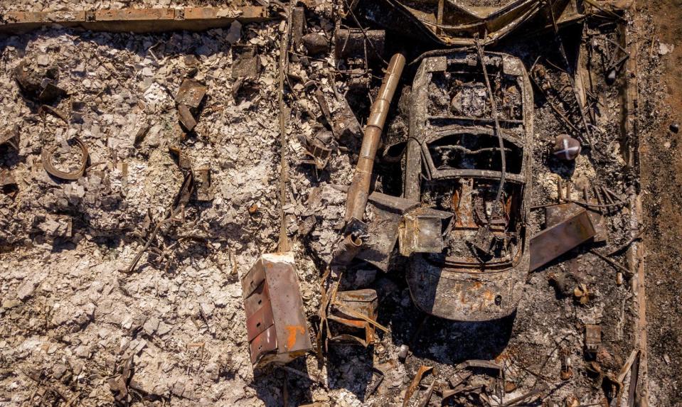 The remains of a burnt vehicle, seen from above.