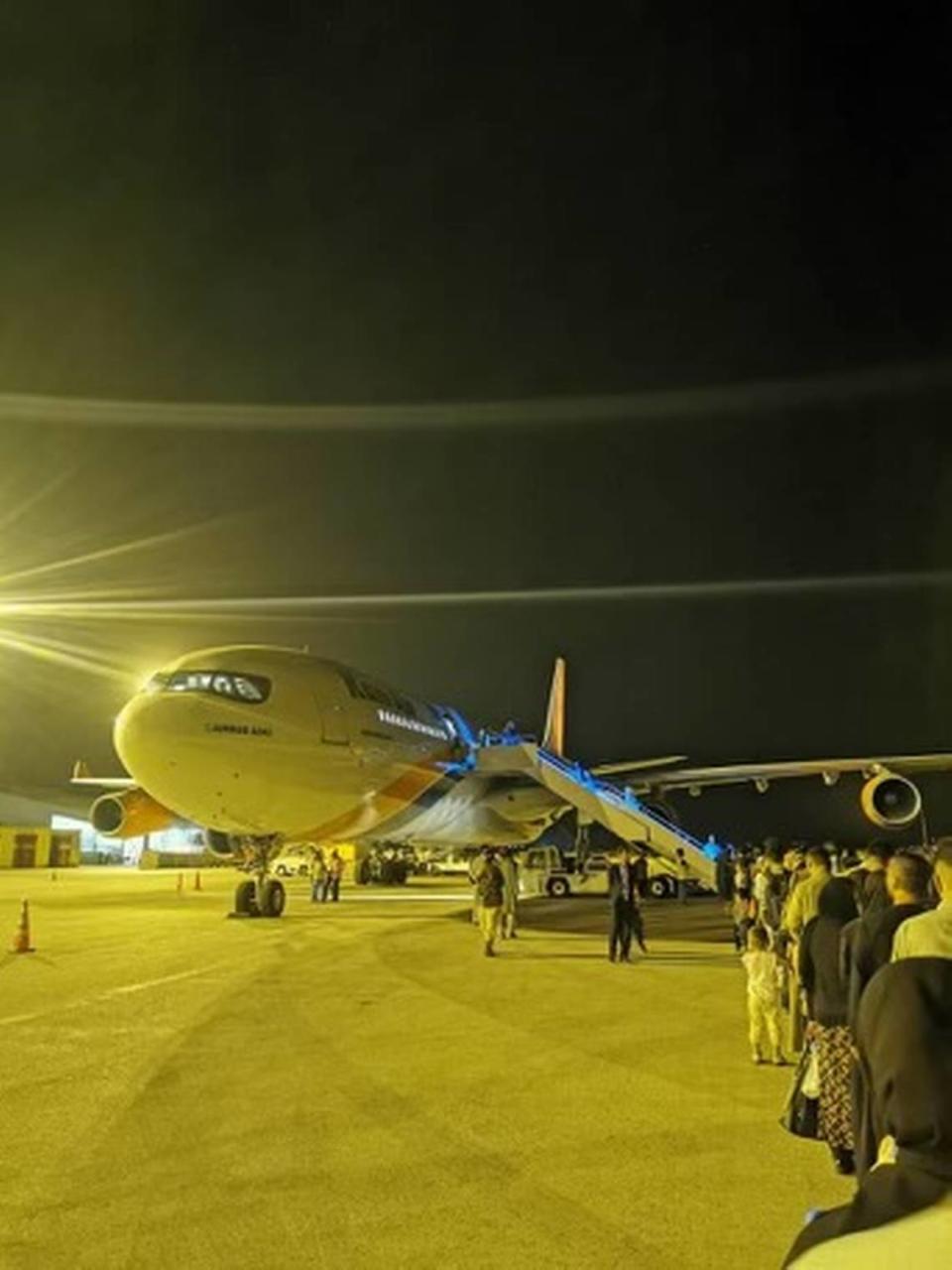 Some 383 Afghans wait to board an Airbus 340 on Sept. 24, 2021, as part of private rescue mission Operation Bella, named for the daughter of Jason Kander of Kansas City.