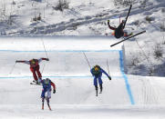 <p>Christopher Del Bosco of Canada, right, flies through the air as Sergey Ridzik, Olympic Athletes of Russia, left to right, Francois Place of France and Siegmar Klotz of Italy compete in the men’s ski cross elimination round at the 2018 Winter Olympic Games in Pyeongchang, South Korea, Wednesday, Feb. 21, 2018. THE CANADIAN PRESS/Jonathan Hayward </p>