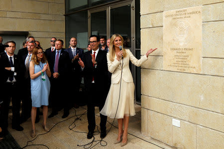 FILE PHOTO: Senior White House Adviser Ivanka Trump and U.S. Treasury Secretary Steven Mnuchin stand next to the dedication plaque at the U.S. embassy in Jerusalem, during the dedication ceremony of the new U.S. embassy in Jerusalem, May 14, 2018. REUTERS/Ronen Zvulun/File Photo