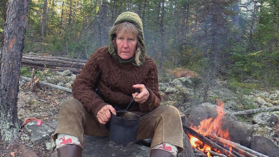Ann Rosenquist tries to keep her strength up in this screen shot from a video she filmed while competing on the survival television show "Alone." She tapped out on Day 19 of her efforts, citing dehydration and a lack of salt.