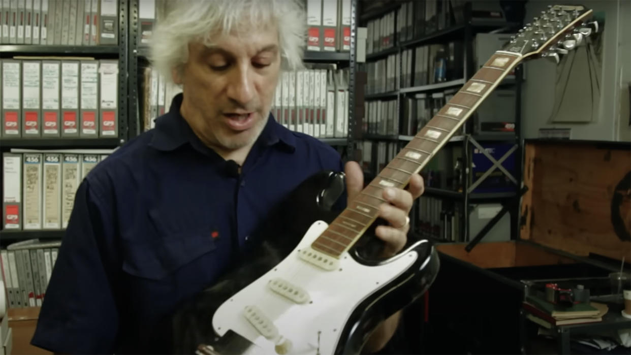  Lee Ranaldo holds the Sonic Sixsteen guitar that Steve Albini built for Sonic Youth. 