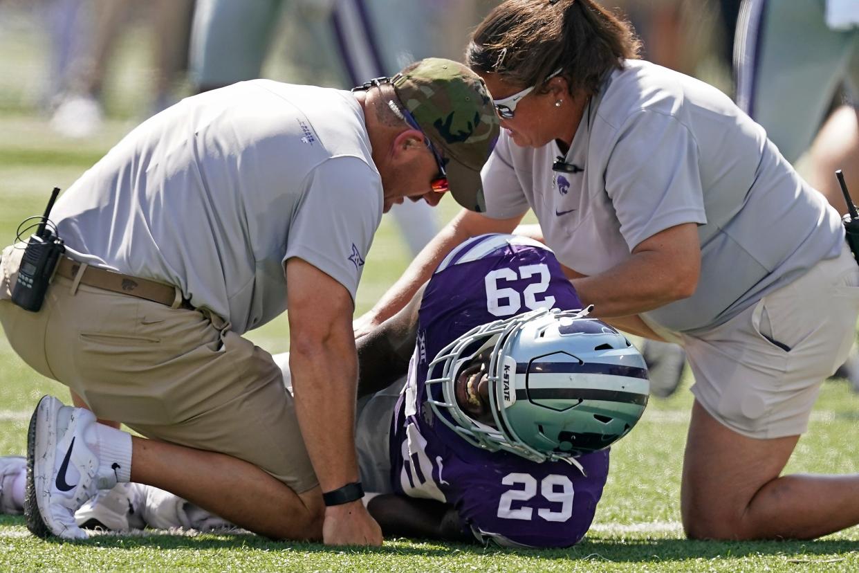 Kansas State's athletic trainers come to the aid of defensive end/linebacker Kahlid Duke after he suffered a season-ending knee injury last Sept. 18 against Nevada. Duke, who also missed the entire spring, is expected to be back at full strength for the Wildcats' Sept. 3 season opener against South Dakota.