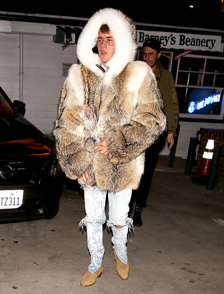 Justin Bieber wears a fur coat as he leaves a diner in Los Angeles, California. Pictured: Justin Bieber Ref: SPL1413104 201216 Picture by: Pap Nation / Splash News Splash News and Pictures Los Angeles:310-821-2666 New York:212-619-2666 London:870-934-2666 photodesk@splashnews.com