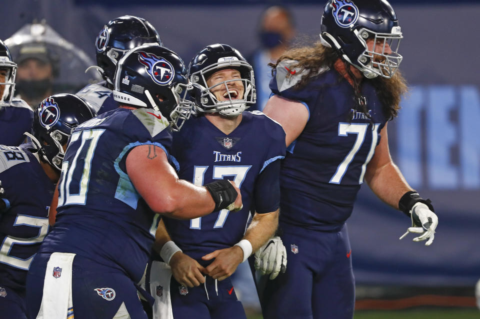 Tennessee Titans quarterback Ryan Tannehill (17) celebrates after scoring a touchdown on a 10-yard run. (AP Photo/Wade Payne)