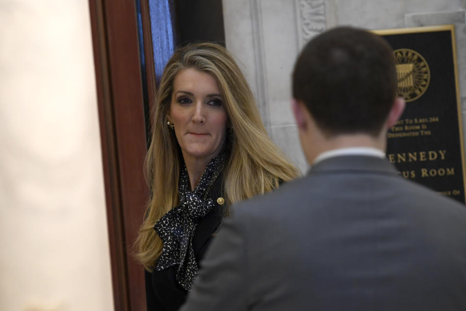 Sen. Kelly Loeffler, R-Ga., arrives for a Republican policy lunch on Capitol Hill in Washington, Friday, March 20, 2020, to work on a sweeping economic rescue plan amid the pandemic crisis and nationwide shutdown that's hurtling the country toward a likely recession. (AP Photo/Susan Walsh)