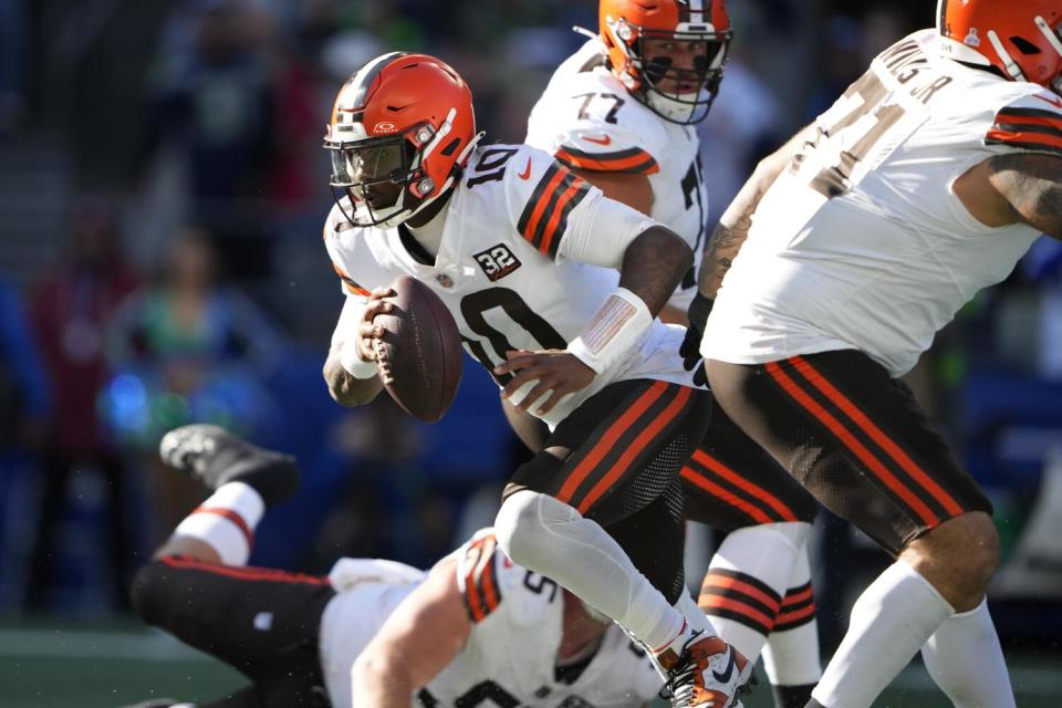 Cleveland Browns quarterback PJ Walker runs the ball.