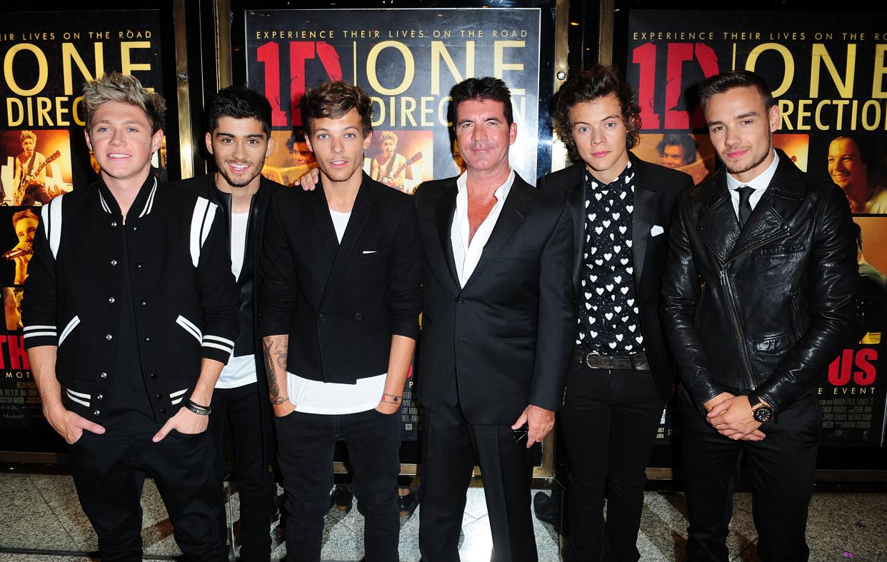 Simon Cowell with One Direction's (L-R) Niall Horan, Zayn Malik, Louis Tomlinson, Harry Styles and Liam Payne at the World Premiere of One Direction: This Is Us, at the Empire Leicester Square, London.   (Photo by Ian West/PA Images via Getty Images)