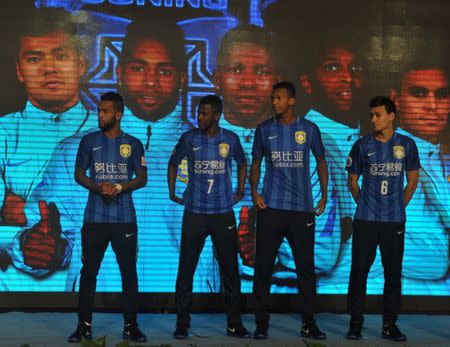 Former Chelsea midfielder Ramires (2nd, L), former Shakhtar Donetsk's Alex Teixeira (L), former Atletico Mineiro's Jo of Brazil (2nd R) and former Australia's Central Coast Mariners Trent Sainsbury (R) attend a Jiangsu Suning FC event in Nanjing, Jiangsu province, China February 18, 2016. REUTERS/Stringer