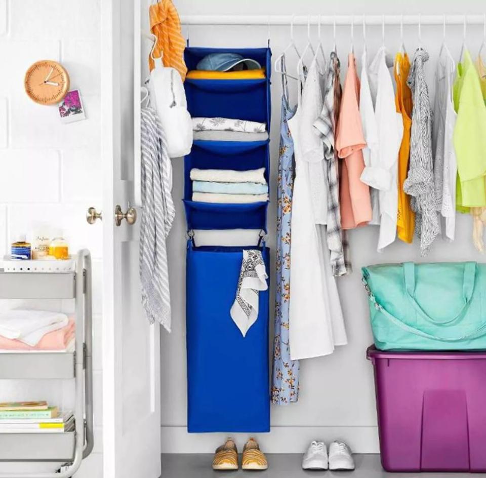 Don't let your hamper put a damper on your closet &mdash; this organizer doubles as extra storage for your foldable favorites and has a hamper that you can hang. <a href="https://fave.co/2U15PQZ" target="_blank" rel="noopener noreferrer">Find it for $10 at Target</a>.